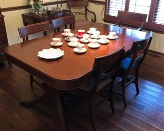 Set of 6 dining room chairs with needlepoint seats, Duncan Phyfe-style table with 2 leaves and pads