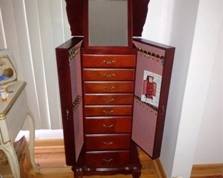 Jewelry stand cabinet and tons of unique vintage brooches necklaces earrings etc. also some newer costume jewelry