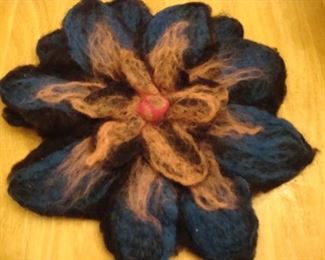 Boiled wool flower brooches imported from Latvia attach to your coat instead of a scarf or use to secure a cape 