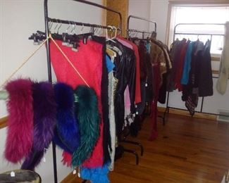 I see magenta, purple, royal, and teal real fox fur collars! In the background I see Alpaca cardigan, vintage Blue leather outfit and some off white Fox Fur Boas...perfect for a winter wedding or event