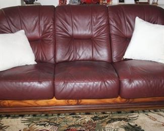 All leather sofa with wood surround.