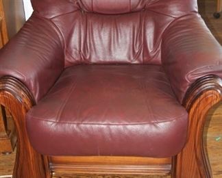 All leather armchair with wood surround.