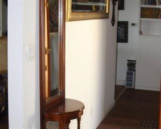 Long gold colored narrow mirror and hall tree/table.