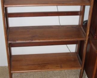 One of two folding three shelf bookcases.