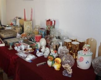 Candles, alabaster owls, crystal preserve jars, onyx bookends, ceramic eggs, Hall Irish coffee mugs.