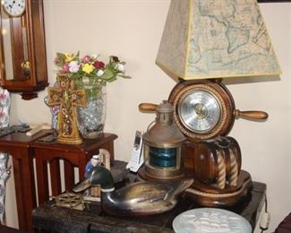 Duck decoy, nautical themed table lamp, two cherry colored stands, alabaster wall plate, brass door knocker. Chiming wall clock.