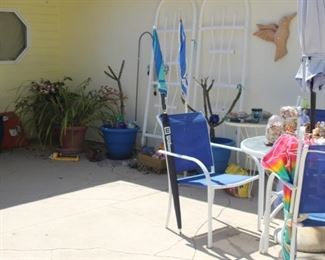 Yard decor, garden bench, plants, pots, crosses, angels, fish, turtles and rabbits.