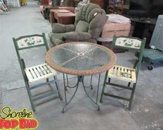 Small Metal Patio Table with Rattan Edge, holds umbrella with 2 tiled back wooden folding chairs