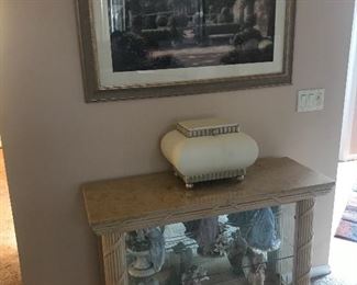Quality entryway console table filled with statuettes!