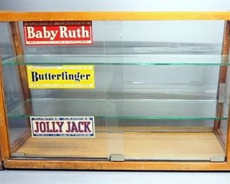 Circa 1930s Candy Counter Display Cabinet, Bullnose Glass, Sliding Glass Doors, With Vintage Candy Bar Stickers On Door, 16.25" H x 25" W x 11" D
