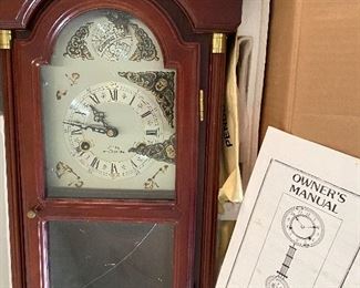 Mahogany Clock in box..glass is cracked