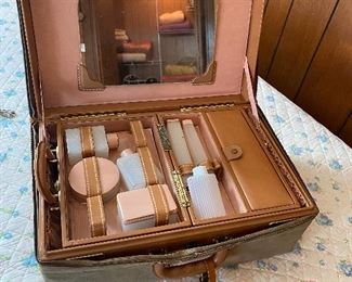 Very Cool..This is a  Travel Train Case Leather with a Canvas Cover. Inside Bottles for travel items, Side Compartment to hold Jewels!! 