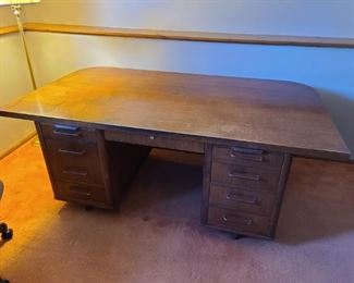 Mid-century Leopold style pedestal executive/partner desk. 76" wide x 42.5" deep x 29" tall. The center drawer is approximately 24" above the ground. Asking $400.