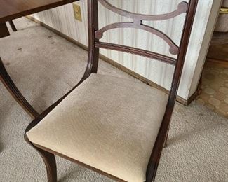 1940's Duncan Phyfe style 3-pedestal, drop-leaf dining table and two chairs. Drop leaves work well. Comes with three additional 12" leaves. Chairs have been reupholstered. Asking $400 for the set.
