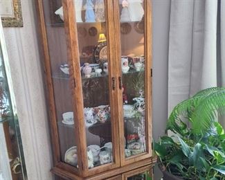 Lighted curio/display cabinet. No bulbs. Flat-back, not specifically for a corner. 71" tall x 28" deep x 35" wide. One solid piece, does not separate. Asking $60.