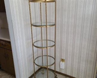Wrought iron etagere with glass shelves. Approximately 5" tall. Shelves are 13" apart. Asking $40.