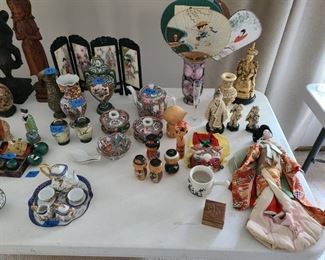 Asian pieces, vases, fans, mini-tea set, ivory, dolls. Various prices.