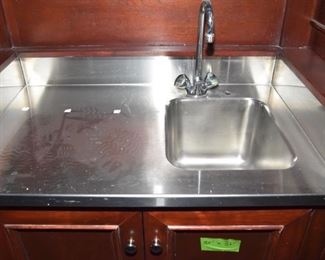 $1,400 to include: cabinets custom built by IXL cabinets, island, counters, sink, faucet
