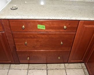 $1,400 to include: cabinets custom built by IXL cabinets, island, counters, sink, faucet
