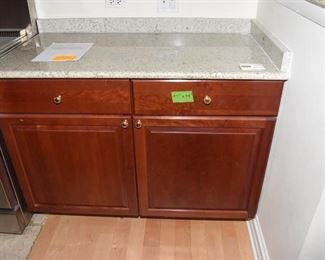 $1,400 to include: cabinets custom built by IXL cabinets, island, counters, sink, faucet