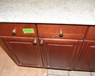 $1,400 to include: cabinets custom built by IXL cabinets, island, counters, sink, faucet