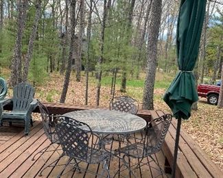 Mid Century Modern Vintage Iron Patio Set with table and 4 chairs that bounce / rock. Believed to be Woodard