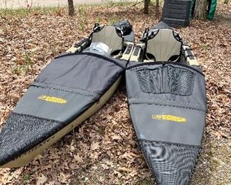 Two Native Ultimate 12 kayaks with skirting and paddles