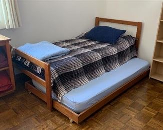 Bunk Beds with roll out trundle underneath one. These are set up currently as 2 twins with trundle.