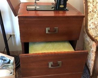Necchi sewing machine and cabinet with stool....