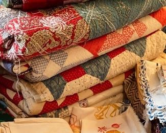 Many hand made quilts