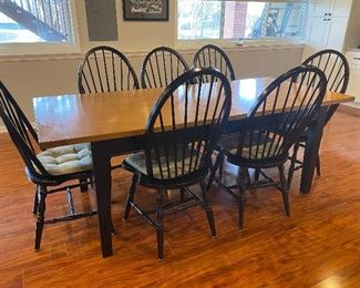 Wooden farmhouse-style table with 7 chairs, black