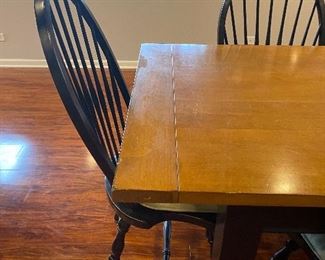 Wooden farmhouse-style table with 7 chairs, black