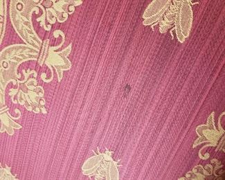 Red upholstered chair with gold detail - 45" high x 38" wide x 30" deep