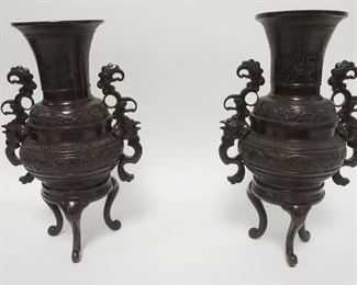 1010	PAIR OF BRONZE ASIAN FOOTED URNS, 11 IN HIGH
