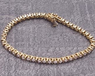 Effortlessly flowing 2.95 ctw Diamond tennis bracelet in a fancy flashy 14k Yellow Gold. Secured with a security clasp for good measure so you never lose your favorite bracelet.