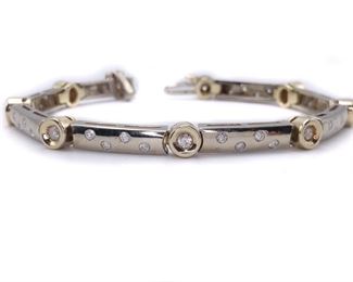 A fantastically designed 1.00 Diamond Bezel Bar Link Tennis Bracelet in 20.3 heavy grams of 14k Yellow/White Gold with a hidden clasp.