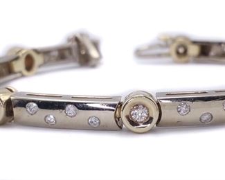 A fantastically designed 1.00 Diamond Bezel Bar Link Tennis Bracelet in 20.3 heavy grams of 14k Yellow/White Gold with a hidden clasp.