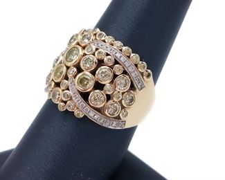 Fancy designer style, this ring will bring a big smile to your face with bezel set natural lemon Yellow Diamonds swirled with white Diamonds in glowing 14k Yellow Gold.