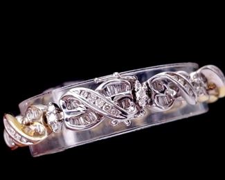 A solid, heavy 31.78 gram 14k gold infinity style diamond bracelet featuring 5.00 carats of very nice goods!