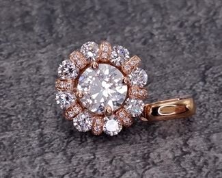 This spectacular 1.08 ctw. center diamond and 1.75 ctw. diamonds for the halo beautifully flow together with 18k Rose Gold with small diamond lined rings in the halo. These small intricate touches let you know that it is a high quality, high end jewelry piece. Chain not included.