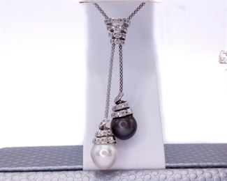 A pearl necklace custom made for an elegant evening. To have both a White Pearl of this size AND a Tahitian Pearl the same size with 0.70 carats of dazzling diamonds is nearly unimaginable. Nearly. Yet, this necklace is created and set in beautiful 18k White Gold. CHAIN INCLUDED (This necklace is meant to match Lot 11). The set is shown in the first two photos, in this lot you are bidding solely on the necklace.