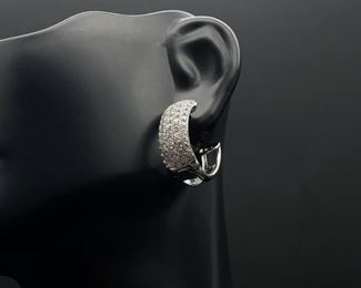 Very popular, upscale diamond pave set hinged hoop earrings meticulously designed in 18k white gold . These match the ring in the next photo.