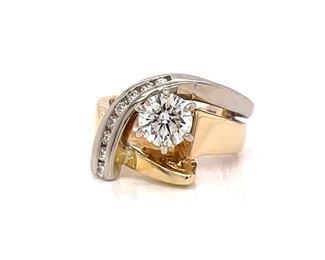Very fine VS2 -IJ 1.00+ carats of diamonds are the center of attention in this exquisitely hand crafted custom free form ring in 14k heavy 7.8 grams of yellow gold. Very well built!