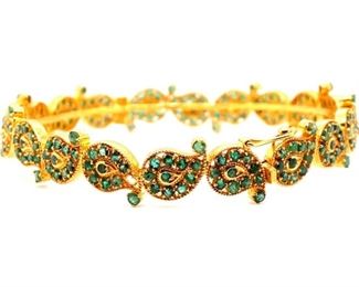 20 Spectacular leaf designs filled in with Genuine Deep Green Natural Emeralds and surrounded by glowing 22k Yellow Gold. The bangle is masterfully hinged and is fitted with a safety clasp so this leafy wonder never falls off.