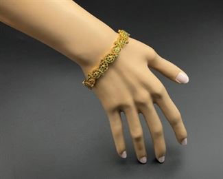 20 Spectacular leaf designs filled in with Genuine Deep Green Natural Emeralds and surrounded by glowing 22k Yellow Gold. The bangle is masterfully hinged and is fitted with a safety clasp so this leafy wonder never falls off.