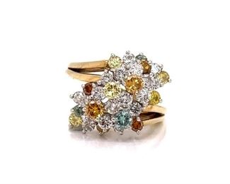 An impressive 3 1/2 carats of natural diamonds! The face of this colorful ring looks like a professional bouquet of flowers swiping to the side amidst a rich golden 18k ring of yellow gold. This is an estate ring with all its own beauty.