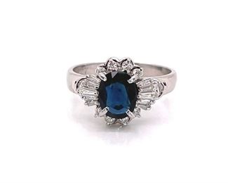 A fantastic Twilight Blue 1.04 Carat natural Blue Sapphire Ring in a sturdy Platinum setting. This sparkling Blue Sapphire is surrounded by fine round and Diamond baguettes. Very stylish, like the royals wear.