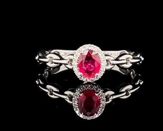 Brand New! This Natural Tulip Red Ruby and Diamond Halo combo has such a fantastic glow. It seems to radiate passion add that to the "chain" styled band of eternity and you have a meaningful mesmerizing, brand new, never worn, ring.