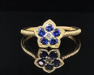 One of our personal favorite rings in the auction because of the finely designed details that set this ring apart from the ordinary! 1/2 carat of natural royal blue Sapphires and fine center diamond all in 14k yellow gold - this one is just perfect!