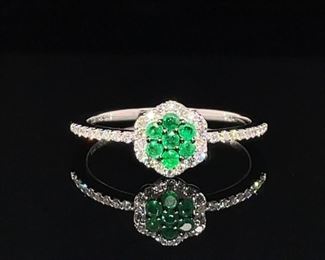 Brilliant green natural Emeralds surrounded by fine diamonds in a halo and on each shoulder; an exquisite look!